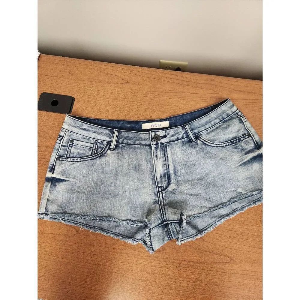 OTB 11 blue denim shorts with raw leg hem. Measures approx 32 waist, 2 inseam an
